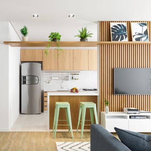 Sala de estar e cozinha de um microapartamento: os espaços são mais reduzidos.